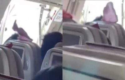 韩亚航空客机飞行时紧急出口舱门被打开  9人呼吸困难 1人被捕